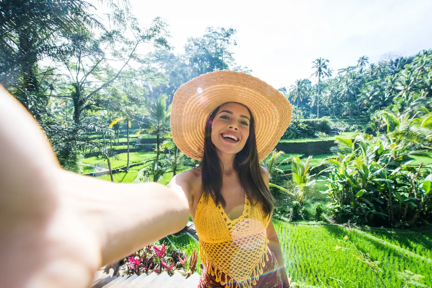 A Woman smiling and taking photo in Bali